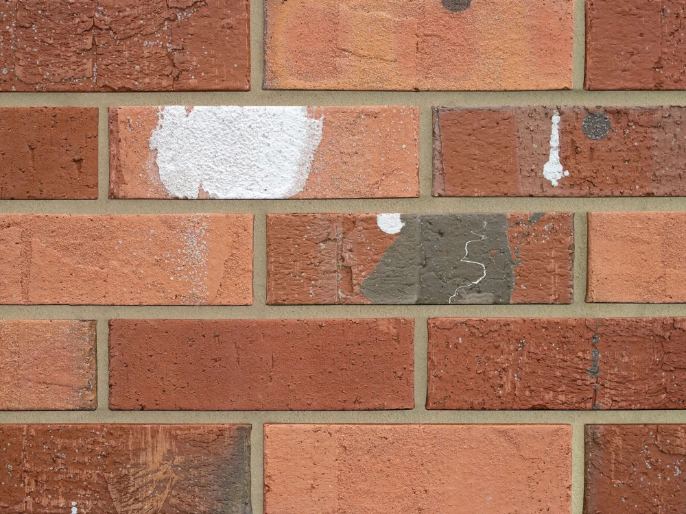 H0030 brick with patches of white and grey.