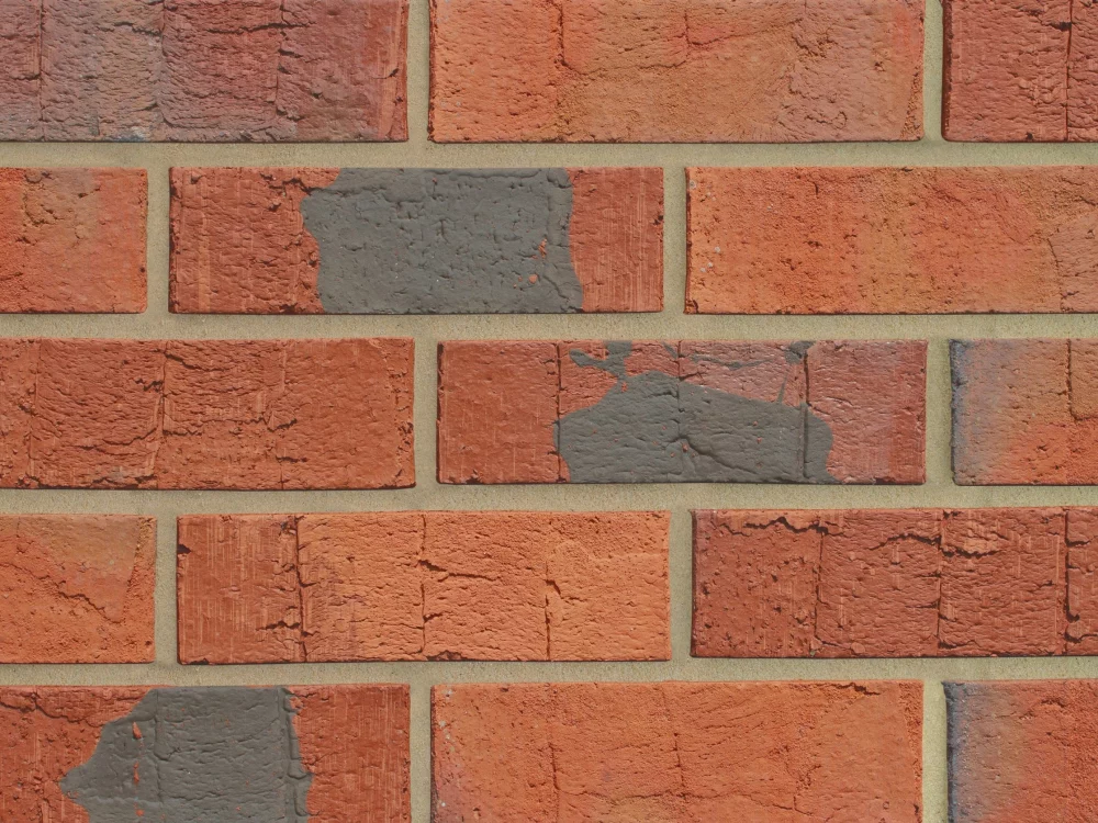 H0033 - A orange and grey brick in a stretcher bond.