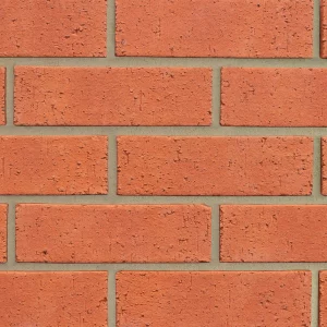 A close-up view of a red brick.