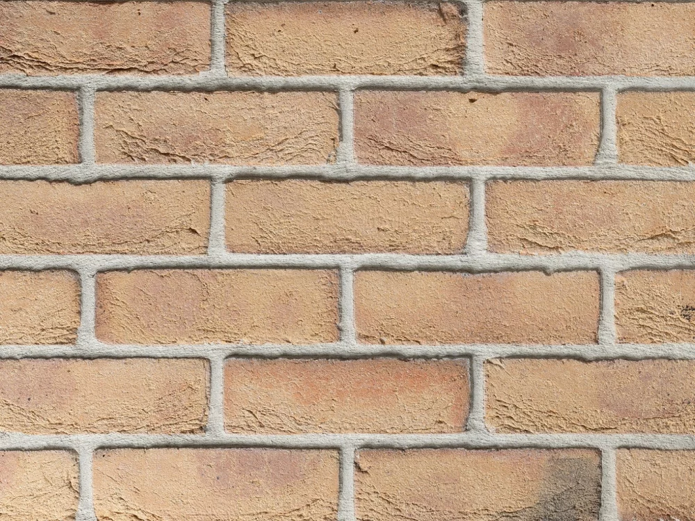 Buff brick panel displaying tones of yellow and cream