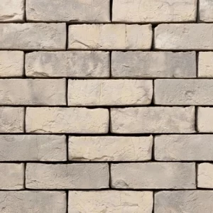 A close-up of a White Light Weathered brick wall shows a beige and grey brick surface
