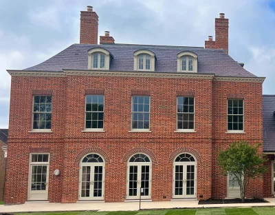 A private two story residence with traditional brickwork and special shaped bricks. Many glass sash windows both ground floor and upper floor.