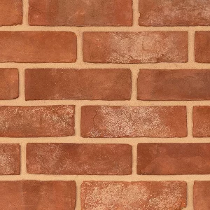Brick sample wall with a uniform pattern and red tones