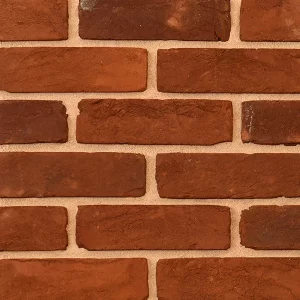 Brick sample wall with uniform pattern in red tones
