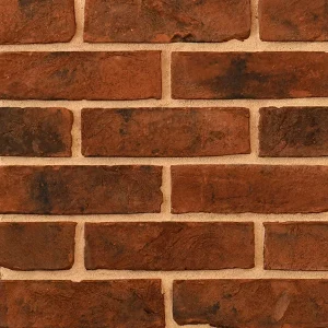 Brick wall with rectangular red bricks and light tan mortar.