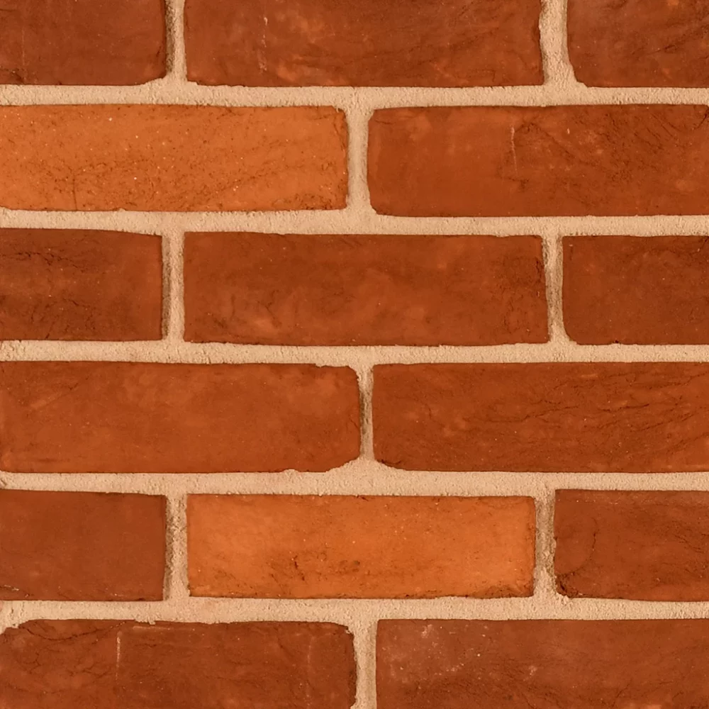brick wall with red tones laid in a uniform pattern