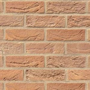 Pink brick horizontal rows of textured rose pink rectangular bricks with light-coloured mortar.