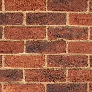 A close up of a Red Multi brick wall, featuring horizontal rows of red bricks and light-coloured mortar.