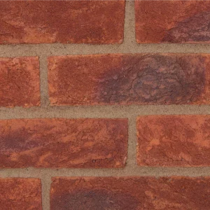 Red tone bricks laid in a pattern with lighter coloured mortar