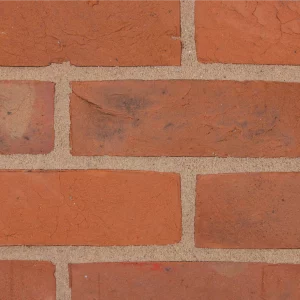 A red brick wall laid in a stretcher pattern and light mortar lines