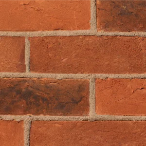 Red bricks laid in a traditional stretcher pattern with light mortar