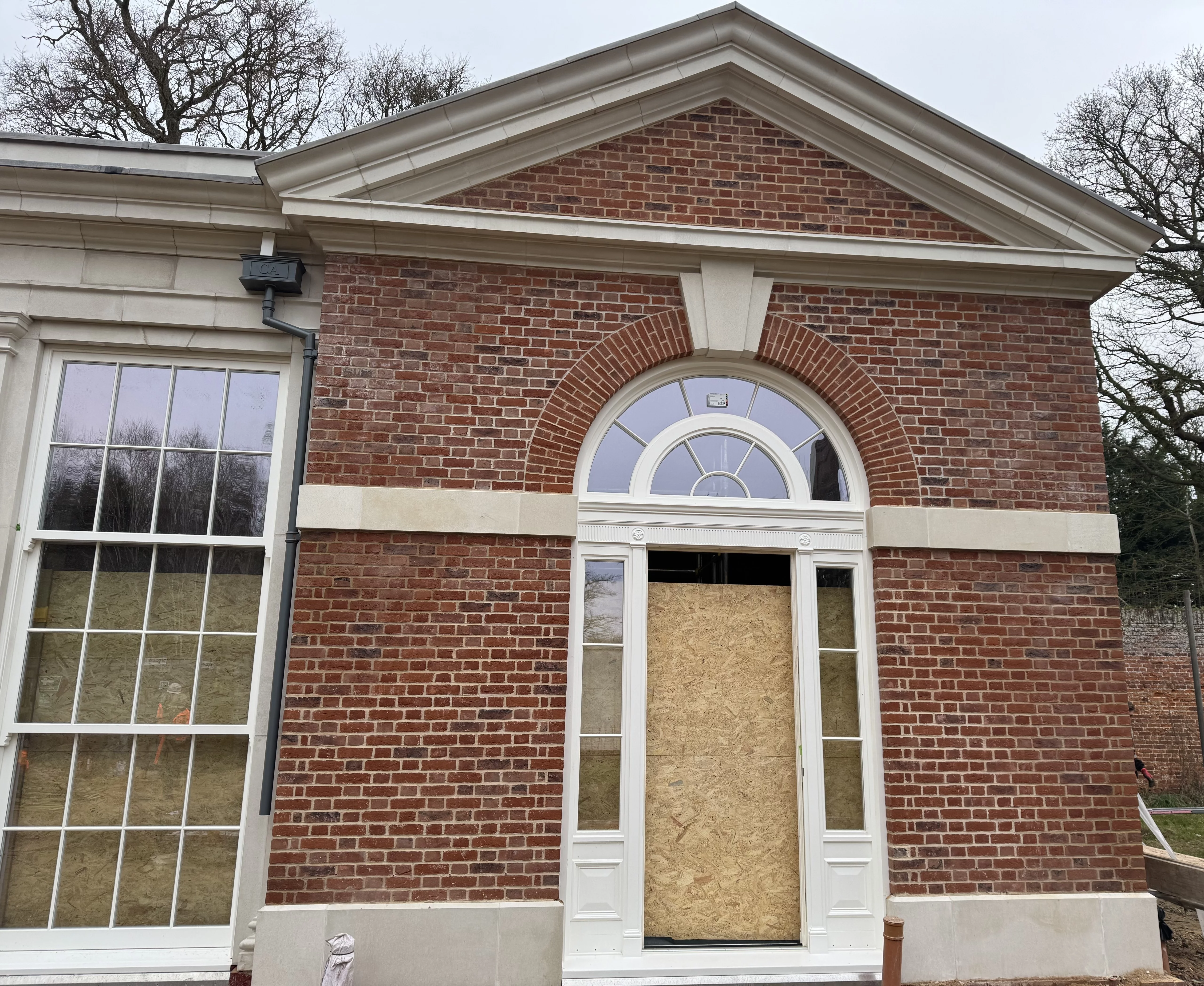 Pre-fabricated brick arches featuring a stone keystone