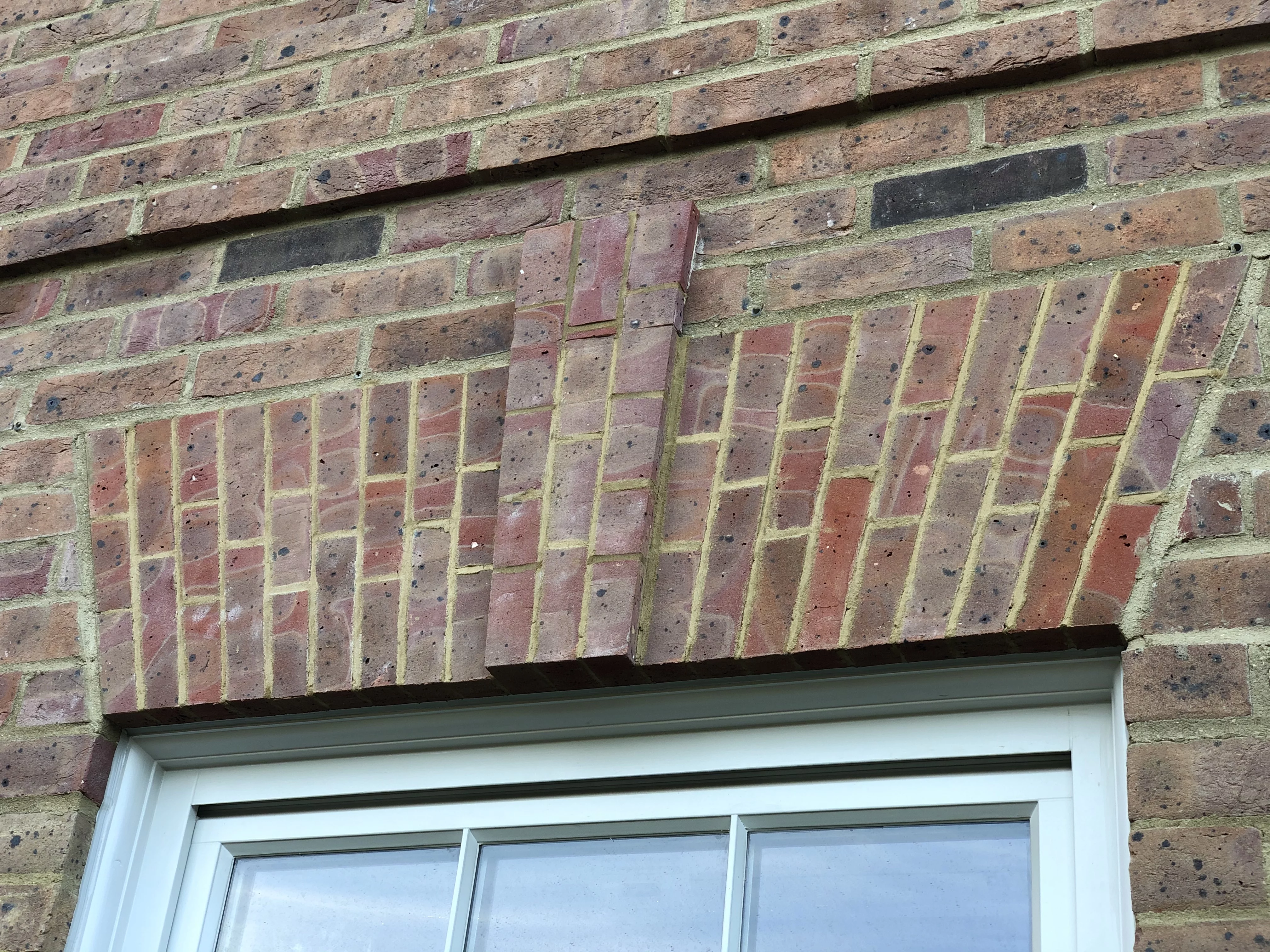 pre-fabricated brick arch sitting above a window