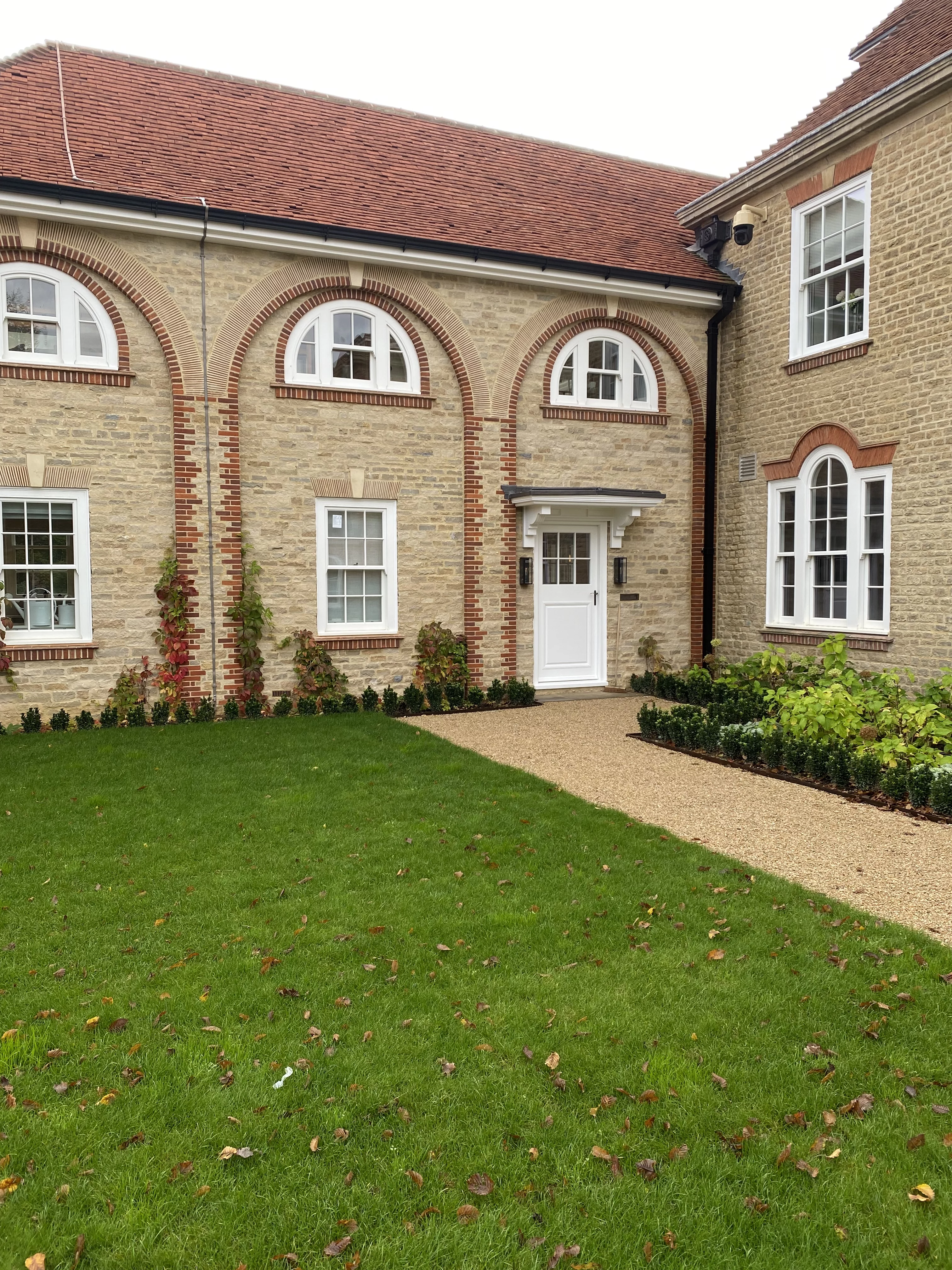 Natural walling stone property with a brick quoin feature