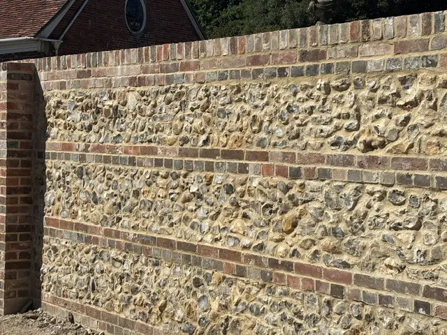 Sand and gravel loose flint garden wall showing knapped and unknapped