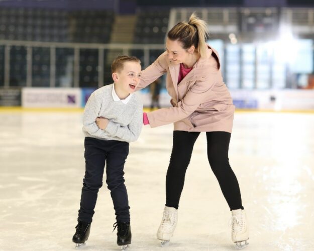 Mom and son ice skating at Braehead Arena Glasgow Shopping Centre