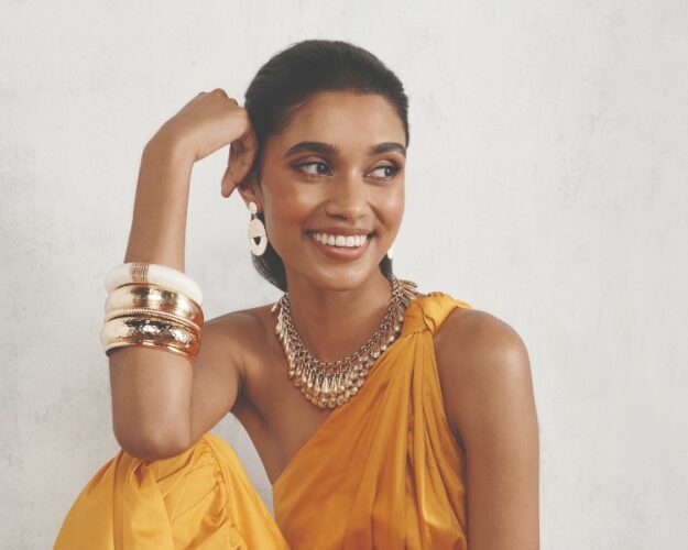 Model wearing Lovista gold jewellery