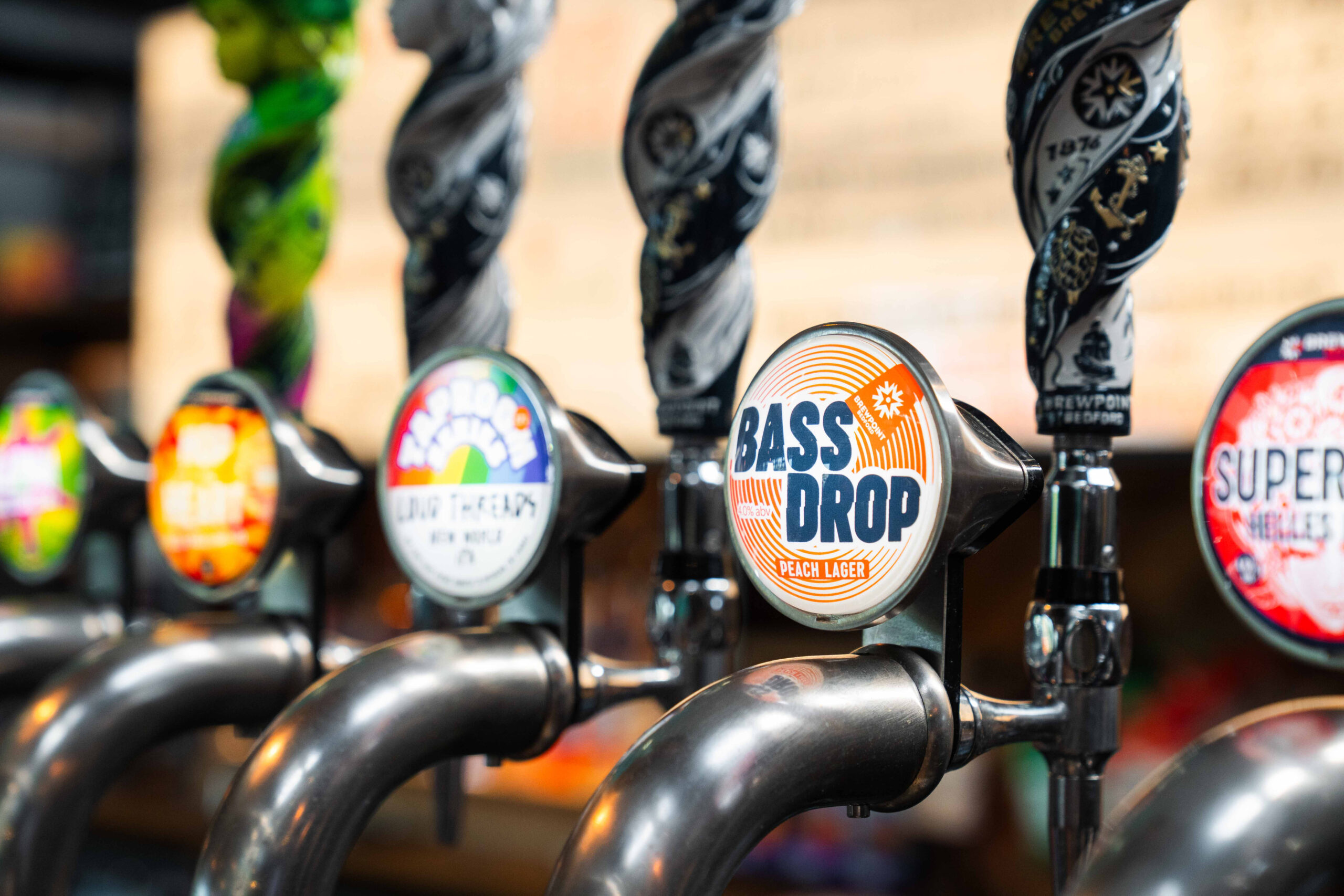 Bass Drop Peach Lager tap badge at Brewpoint bar