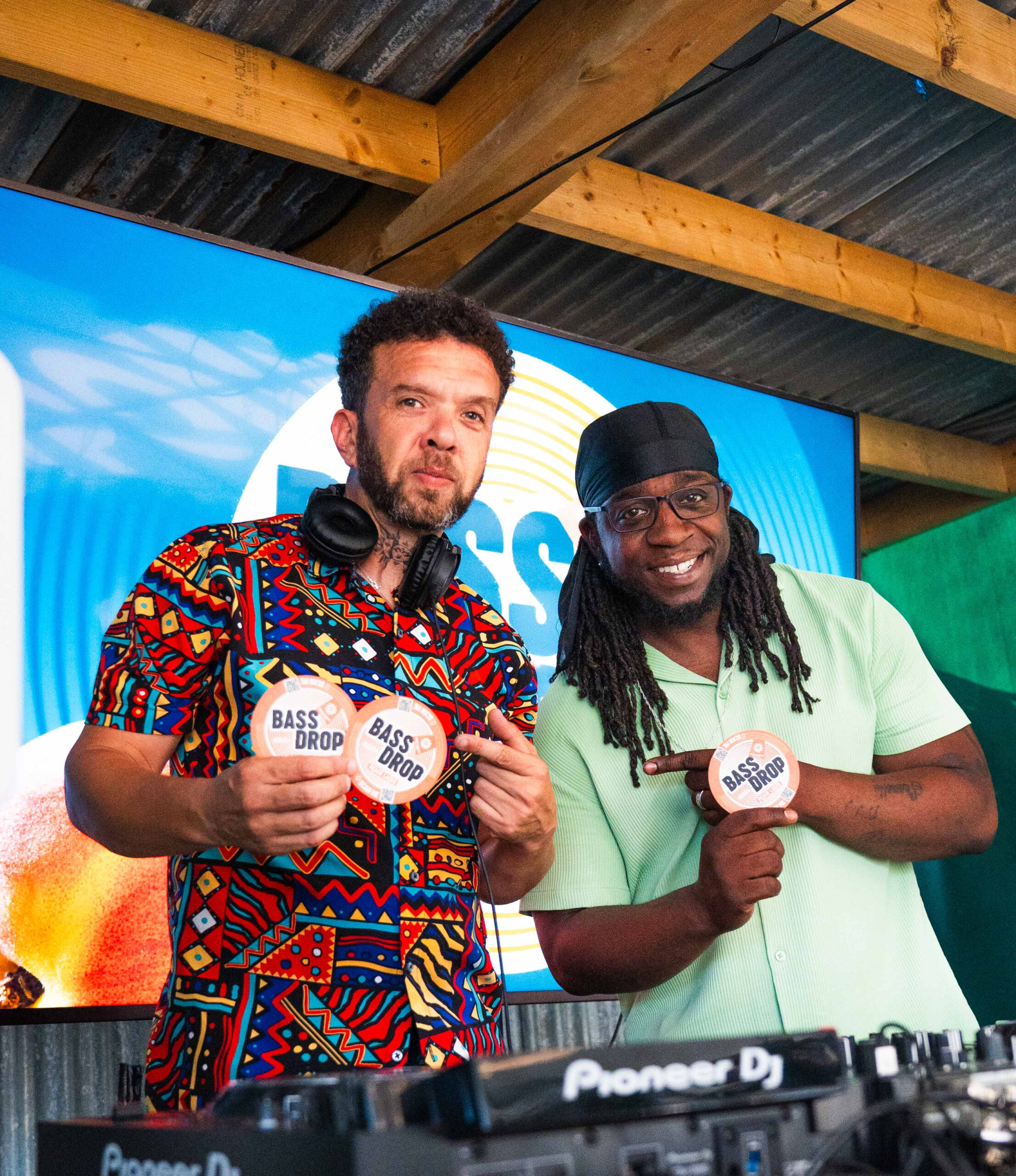 DJs performing in front of Bass Drop campaign screen at Brewpoint event