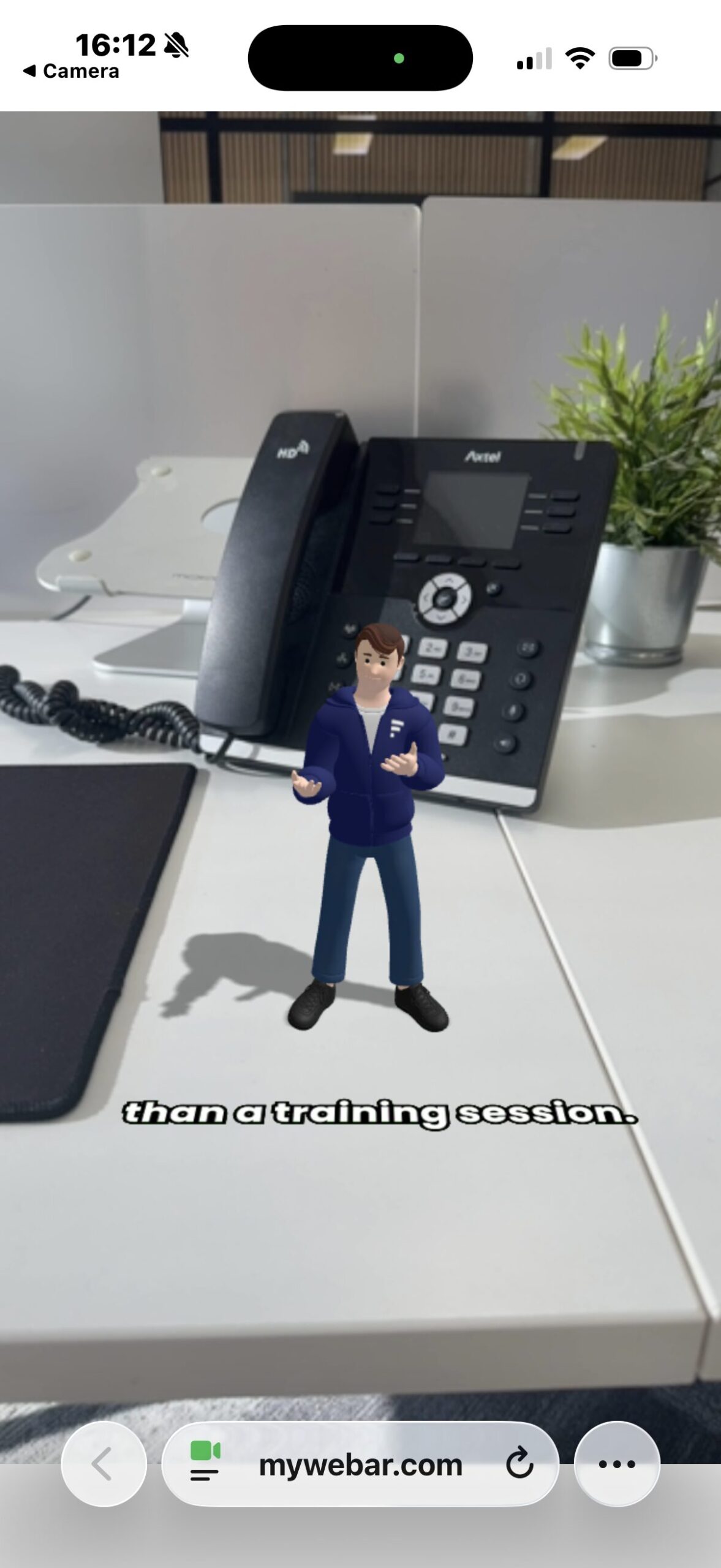 Smyle AR character on office desk