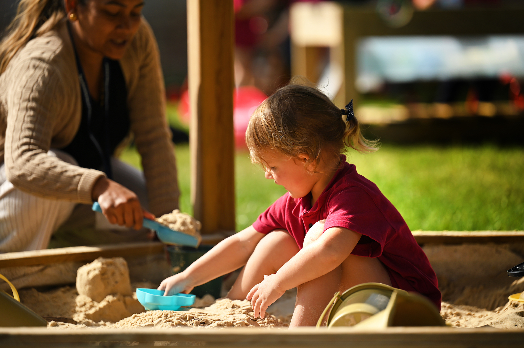 Nursery children learning through play outdoors at Swanbourne House