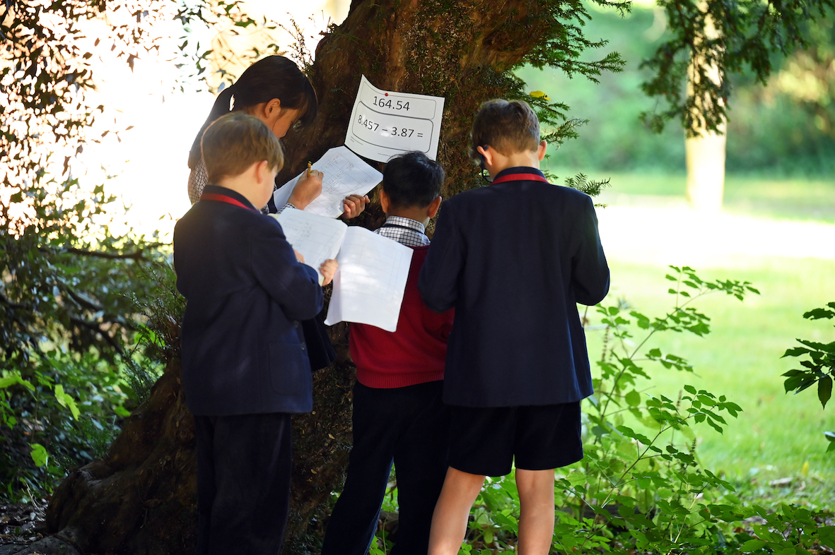 Pupils solving maths problems collaboratively at private school