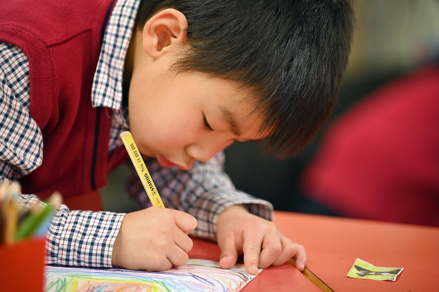 Pupil practising his writing at Swanbourne House | Independent School Buckinghamshire