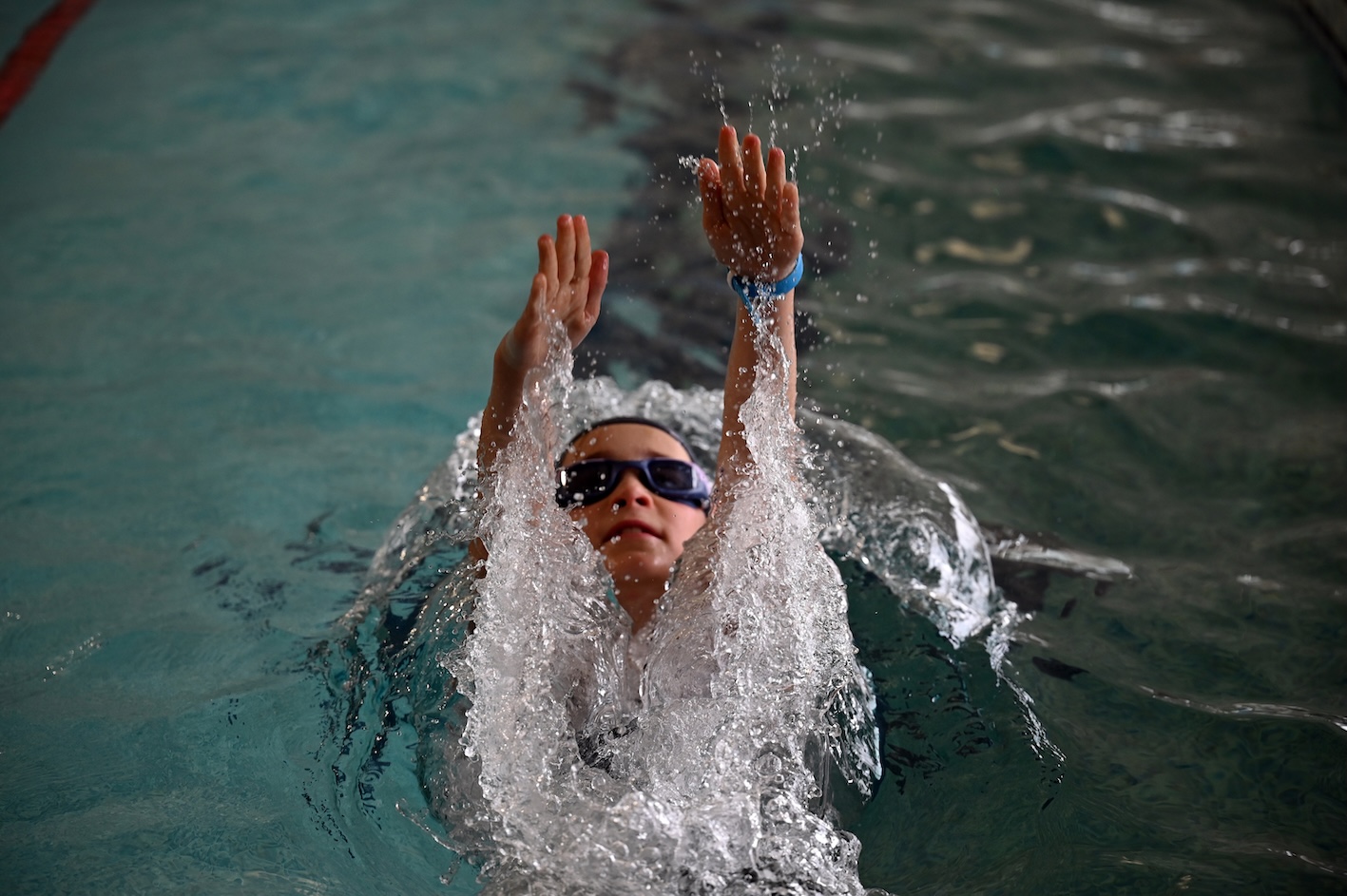 Children enjoying swimming lessons at Swanbourne House independent school near Milton Keynes.